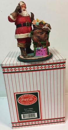4412-1 € 40,00 coca cola beeldje kerstman met zak ca 14 cm